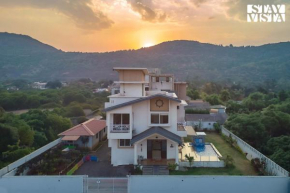 StayVista's Kaarma Villa - Valley-View Villa with Outdoor Pool, Lawn featuring a Gazebo & Machan